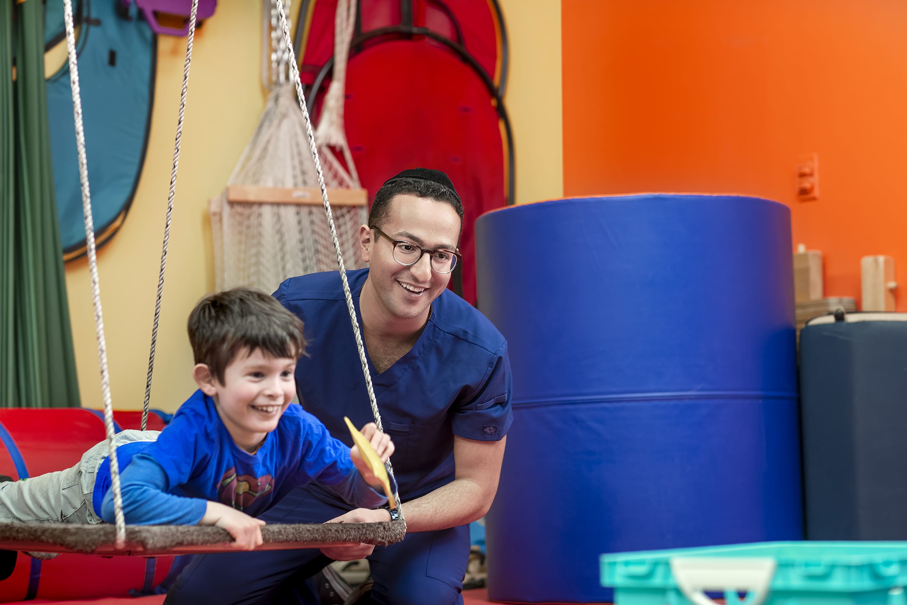 Touro alumni Aaron Kattan with child physical therapy patient